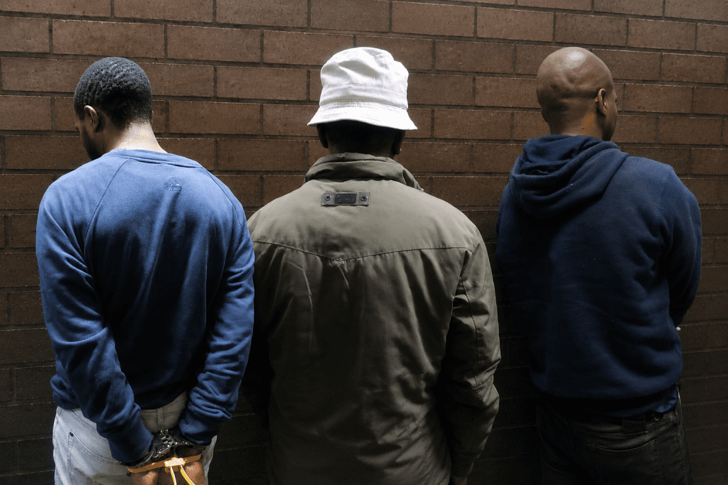 Inner-City Raids Uncover Plot Orchestrated from Prison, Police Seize Guns
